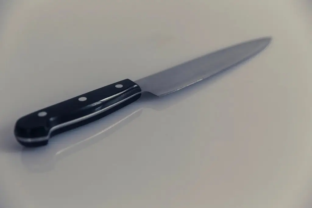Kitchen knife on a wood cutting board