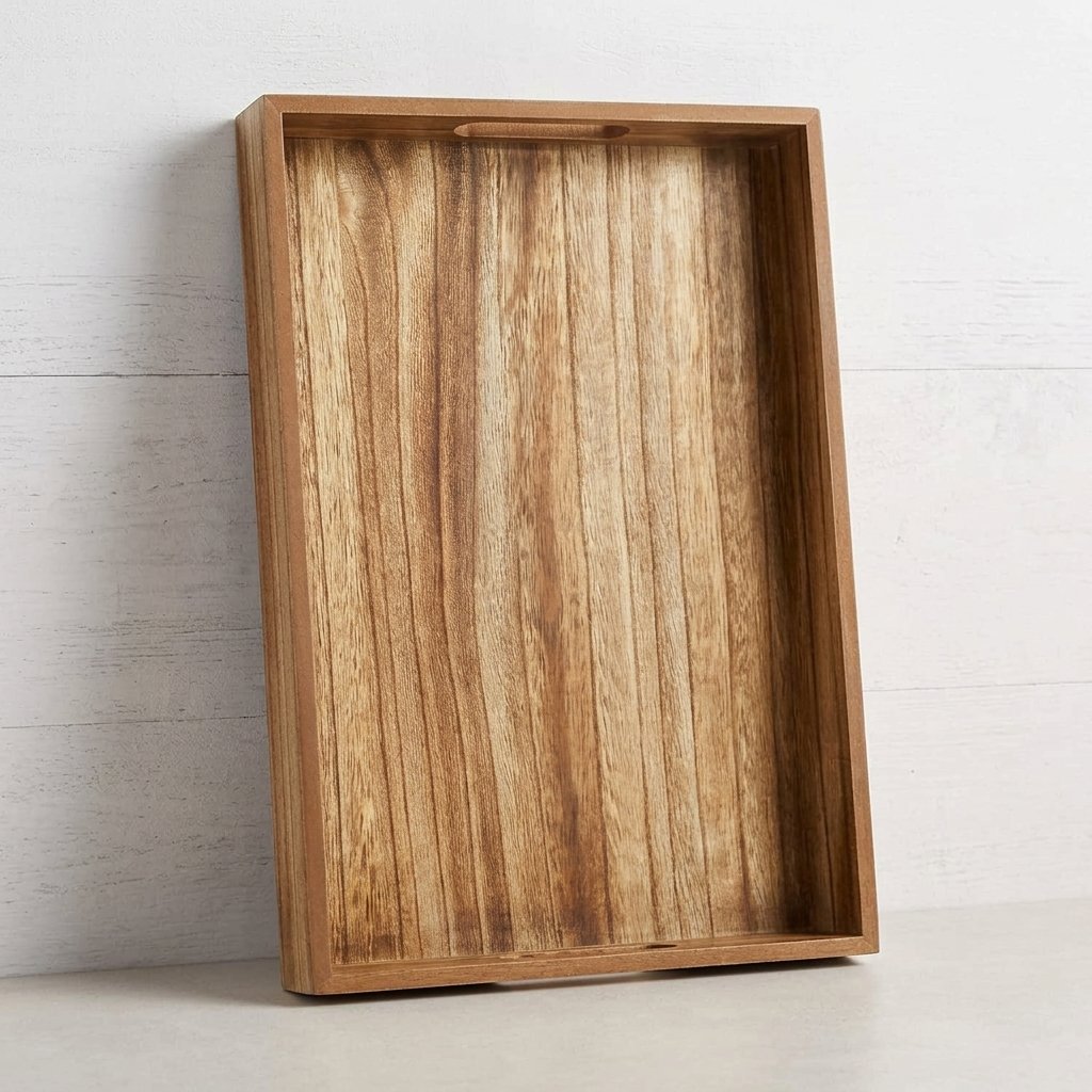 Rustic brown wooden serving tray with handles on a coffee table