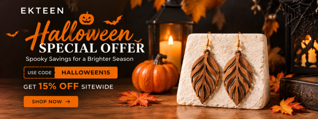 Ekteen Halloween sale banner featuring wooden leaf-shaped earrings displayed on a cream stone stand with pumpkins, glowing candles, autumn leaves, and Halloween decorations. Includes promo code HALLOWEEN15 for 15% off sitewide and a Shop Now call to action.