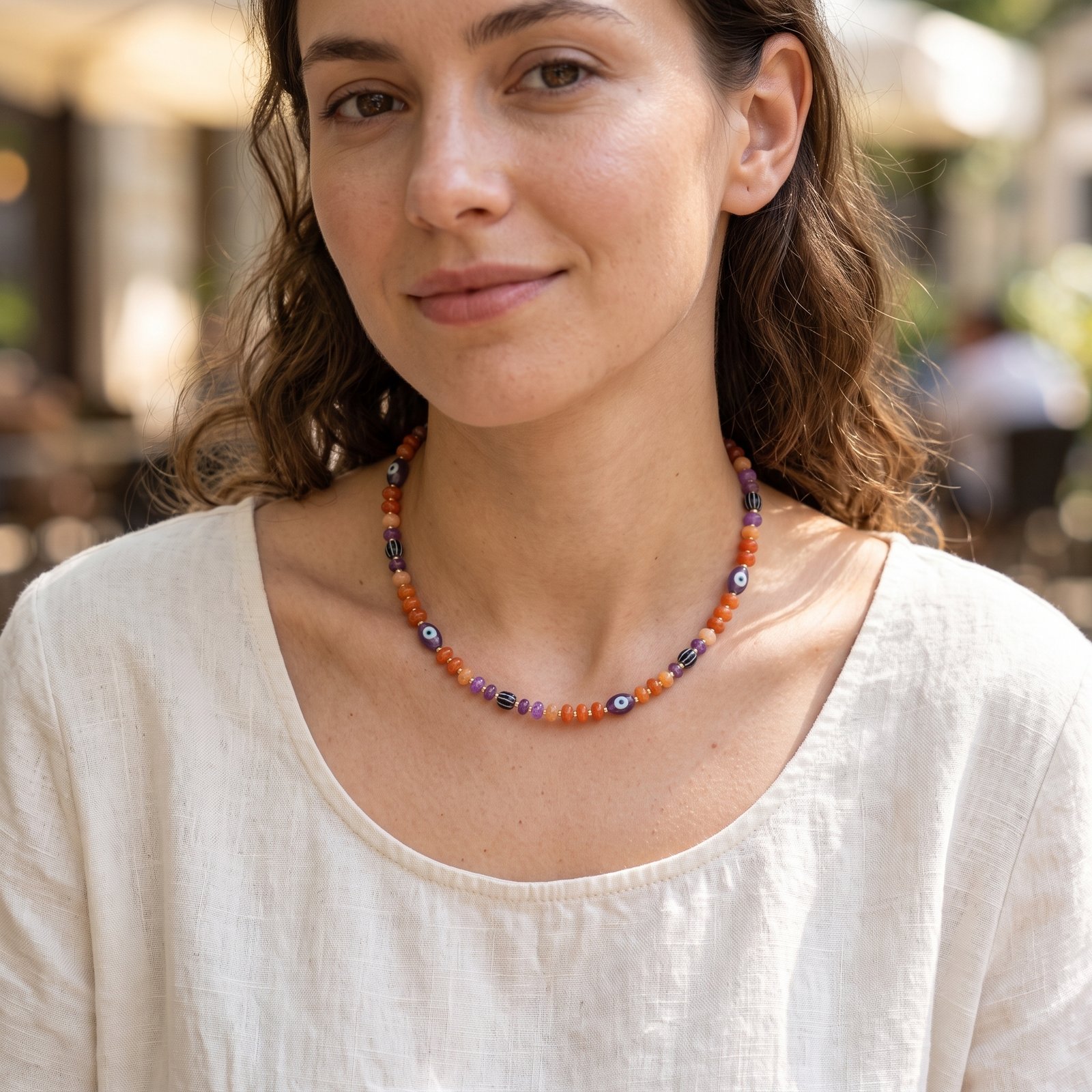Halloween beaded necklace with evil eye and pumpkin beads on a copper chain choker